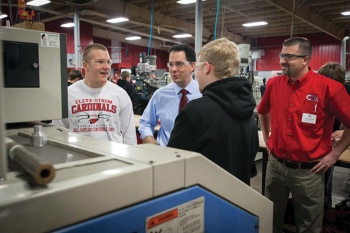 Craig Cegielski works with student workers at Cardinal Manufacturing.